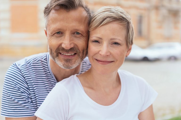 Smiling friendly couple posing for a portrait