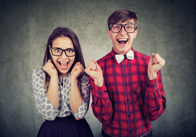 Excited couple looking thrilled