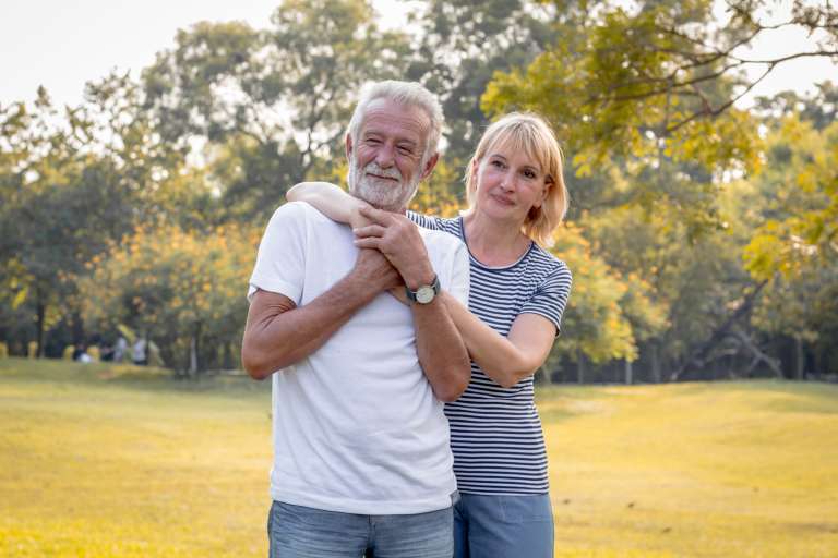 Happy smiling of senior couple in a park on a holiday.