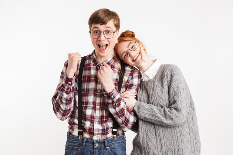 Smiling couple of school nerds